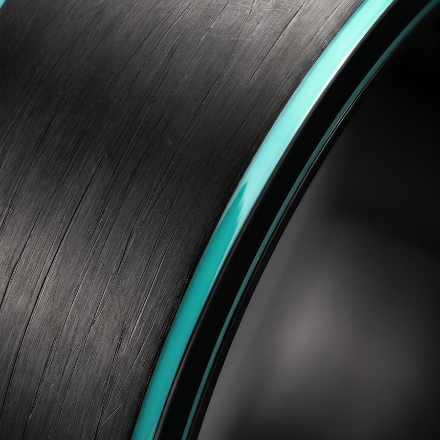 Brushed titanium surface and the mint edge up close